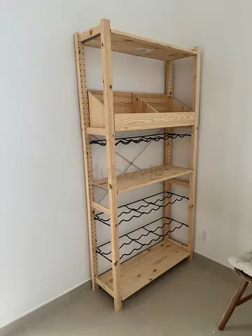 IKEA pine shelving unit with wine racks and storage bins - light wood