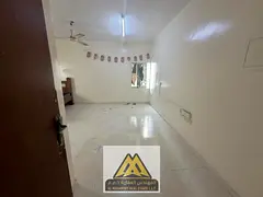 A spacious studio apartment with a semi-detached kitchen in the Al Nakheel Corniche area of ​​Aj