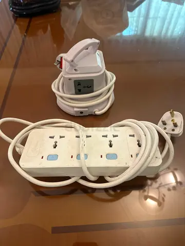 Two White Power Extension Strips with Multiple Outlets and Cables