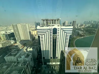 Apartment for annual rent in Al Majaz 1. The apartment has two bedrooms, a living room, three bathrooms, a master bedroom, free air conditioning, gym,