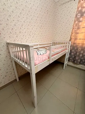 White wooden toddler loft bed / elevated crib with safety rails with mattress