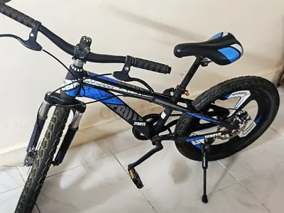 Used boys' blue & black mountain bike - medium size