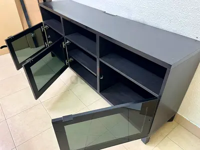 Dark wood TV console / storage cabinet with glass doors - good condition