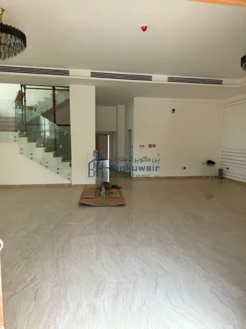 Two adjoining villas for sale in Sharjah, Al Tayy East area. They are situated in a prime location on a paved road and are close to all amenities.