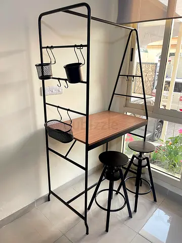 Compact industrial-style bar table with shelving and 2 stools