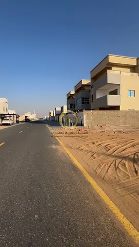For sale: a residential land in Sharjah, Al Houshi, Al Badiya district, area 10,000 sq ft on an 18-meter street