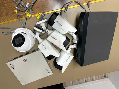 Hikvision CCTV kit — 4 bullet cameras + 1 dome, DVR, power box (used)
