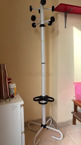 White freestanding coat rack with umbrella holder