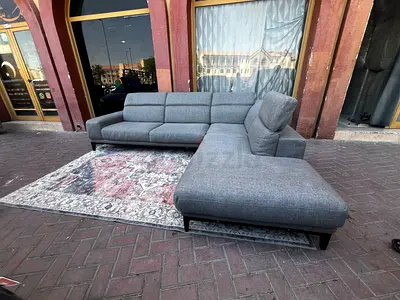 Selling in excellent Condition Natuzzi Shape Sofa with adjustable head Rest