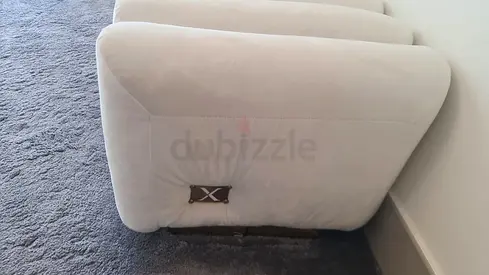 Long cream upholstered bench / low sofa (modern ribbed design)
