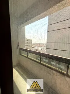 A spacious one-bedroom apartment with a balcony and a view in Al Rawda 2 area, close to all services
