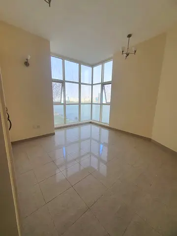 🏡 **For Rent | Distinctive Apartment with a Direct View of Al Majaz Amphitheatre** ✨ 🌟 **Features:** ✅ 2 Bedrooms + Living Room. ✅ Stunning direct