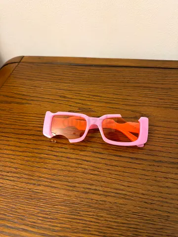 Pink rectangular fashion sunglasses with orange lenses