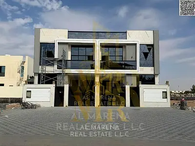 Own a 5-bedroom townhouse with two floors and a rooftop, including registration and ownership fees, in the Al Yasmin area on the main road. Own a 5-b