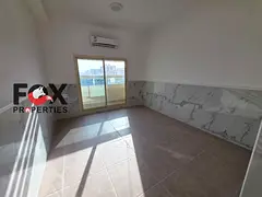 Apartment with a living room for annual rent in Ajman, in Al Rawda 2 area. Laundry room,balcony with