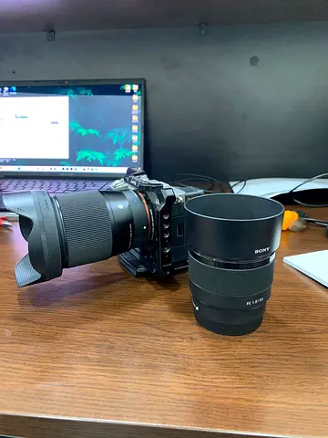 Sony mirrorless camera body with two Sony E-mount lenses (Fe 1.8 lens + zoom)