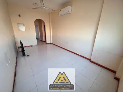 Annual rental 2-bedroom apartment in Al Rawda 3, Ajman. Closed kitchen, 2 bathrooms, split AC, ground parking available, prime location near Sheikh Am