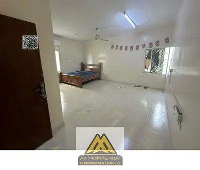 Annual Rent: Huge studio in Al Nakheel 1, Ajman, second building from Corniche, separate kitchen, split AC, free maintenance, AED 16,997, payable in 4