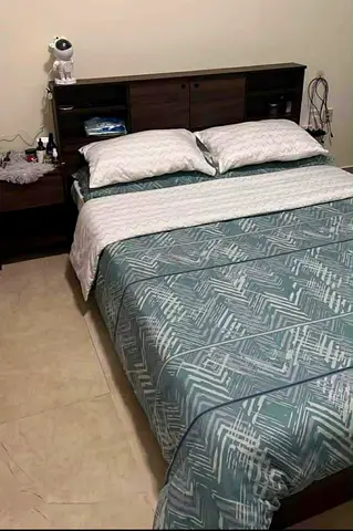 Queen bed frame with headboard shelving and matress - dark wood