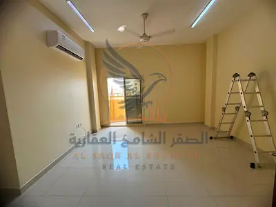 For annual rent directly on Sheikh Ammar Street Ajman a one-bedroom apartment with a living room and bathroom featuring modern clean and contemporary