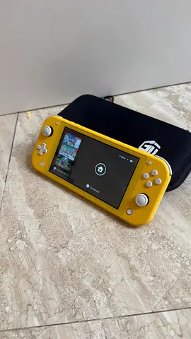 Nintendo Switch Lite Yellow + GamerTek Case