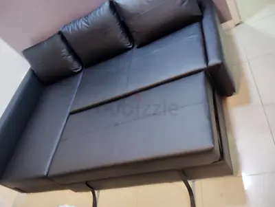 Black faux leather 3.seater sofa bed with storage, good condition