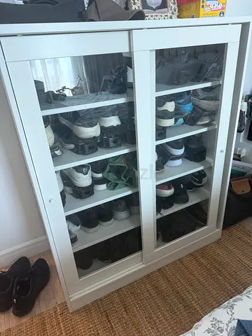 IKEA white glass-door shoe cabinet with sliding door