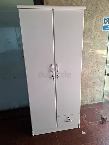 Tall white storage wardrobe / cabinet with lock — good condition
