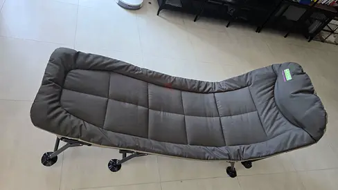 Foldable camping reclining bed with padded mattress - used