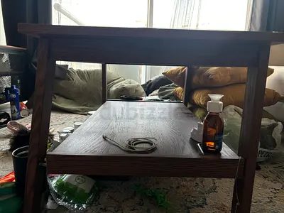 Solid wood coffee table with lower shelf - used condition