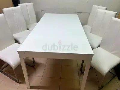 White Dining Table with 6 White Upholstered Chairs - Good Condition