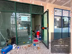Commercial shop for annual rent in Al Nuaimiya 2, Ajman, featuring 3 floors with a total area of app