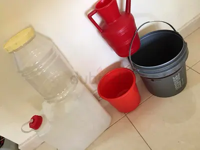 Assorted Plastic Buckets and Water Containers