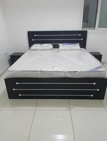 Double bed frame with mattress and two bedside tables - dark wood