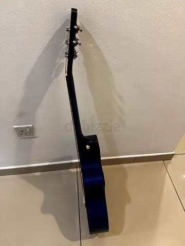 Used blue acoustic guitar in good condition