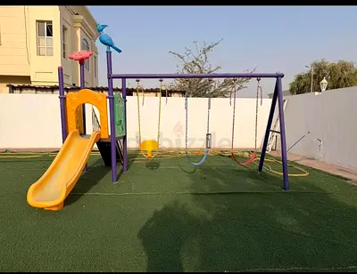 Outdoor kids playset with slide and triple swings - good condition