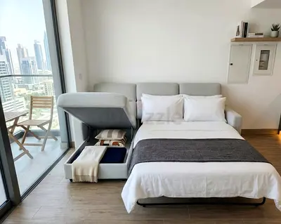Modern L-Shape Sofa Bed featuring a spacious storage compartment and an easy pull-out sleeping mattr
