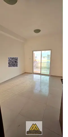 Annual Rent: 1-bedroom apartment in Al Nuaimiya 2, balcony, closed kitchen, central AC, free maintenance, AED 24,997, payable in 4 cheques.
