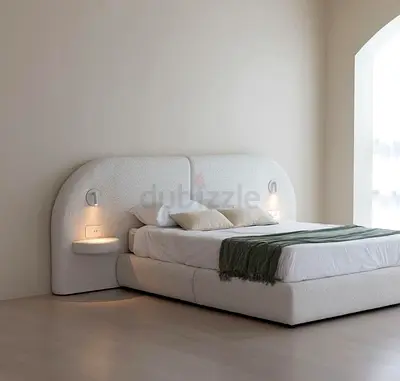 Modern upholstered king bed with built-in bedside shelves and lights