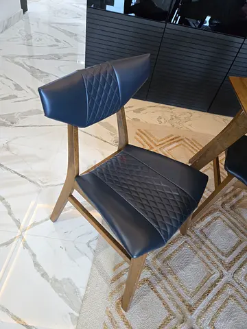 Set of 4 modern navy faux-leather dining chairs with wooden frame and table