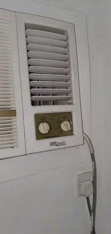 Window air conditioner unit (compact, wall-mounted) - used