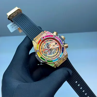 This appears to be a Hublot Big Bang Unico Titanium Rainbow wristwatch, featuring a multi-colored ge
