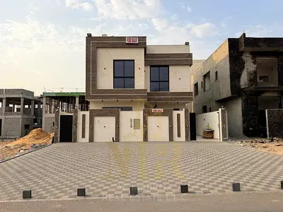 Luxury villa for sale in Al Helio 2 – Ajman | Two floors + roof | 5 master bedrooms + maid's room |