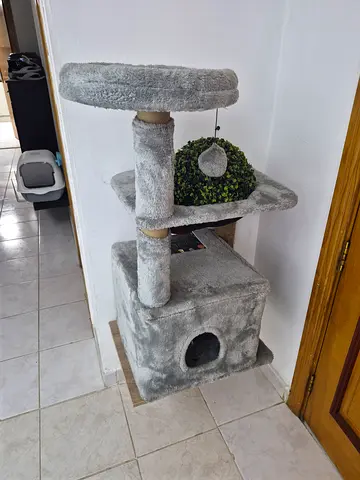 Gray multi-level cat tree with condo and scratching posts
