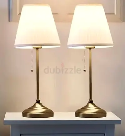 Pair of brass bedside table lamps with fabric shades