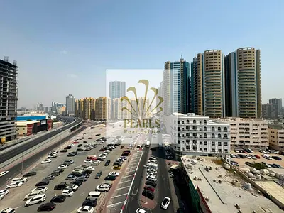 Annual Rent in Ajman - Premium Fully Furnished 2BR & Hall in Al Wahah Towers Al Rashidiya 1 | Luxury Furniture | Open View | Gym & Pool | Parkin