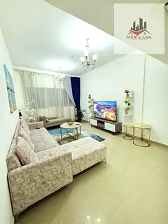 Sharjah Al Taawun, two-bedroom apartment with a living room, kitchen, and two bathrooms with showers