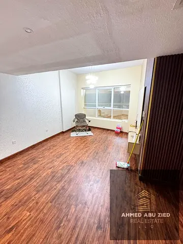 Two-bedroom apartment with a living room for annual rent in Garden City, Al Hamidiya, Ajman. Comfortable spaces, two bathrooms, prime location close t