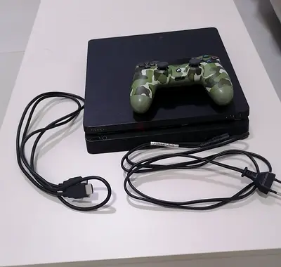 Sony PlayStation 4 Slim with controller and good games