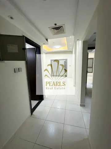 Luxury 1-bedroom apartment with hall and 2 bathrooms in Emirates City Towers, Ajman, with parking. Annual rent AED 30,000, payable in 4 installments.